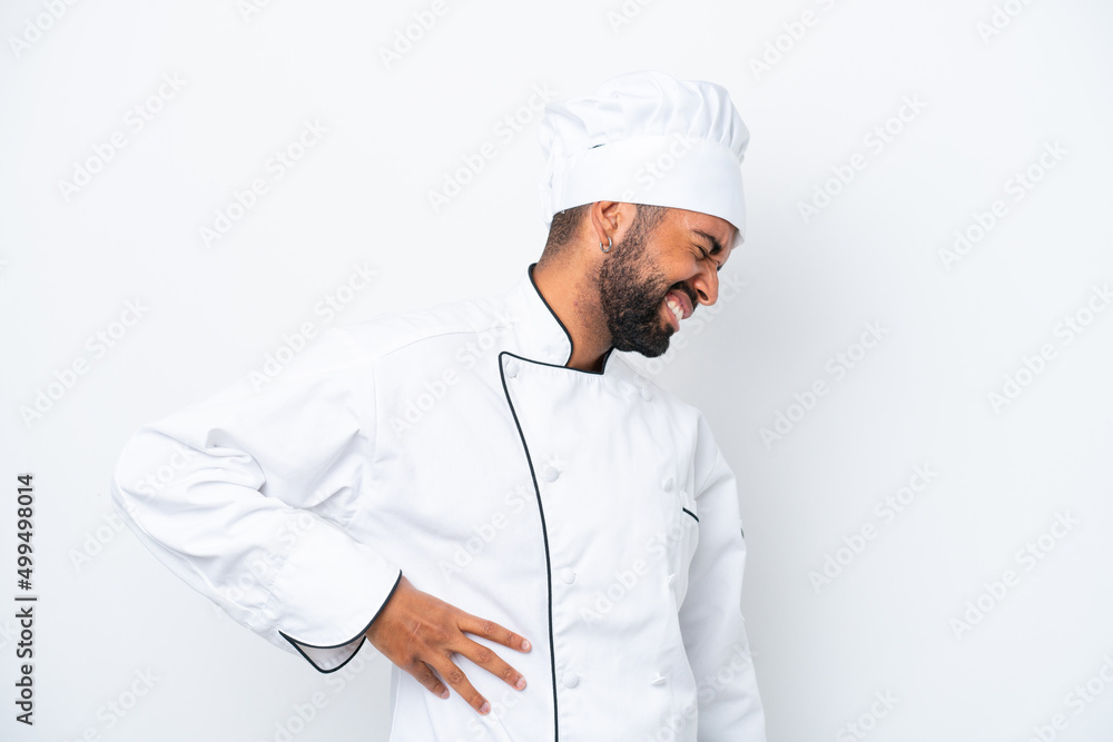 Young Brazilian chef man isolated on white background suffering from backache for having made an effort Young Brazilian chef man isolated on white background suffering from backache for having made an effort