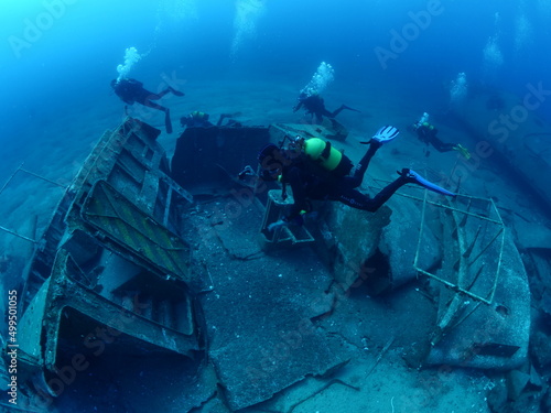  ship wreck underwater deep sea bottom metal on ocean floor scuba divers to explore