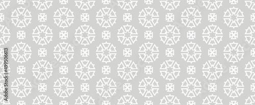 Background pattern with white geometric elements on a gray background. Seamless background for wallpapers, textures. Vector image. 