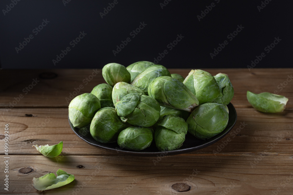 Brussels sprout on wood background. Brussel cabbage. Brussels sprout on wood background. Brussel cabbage.