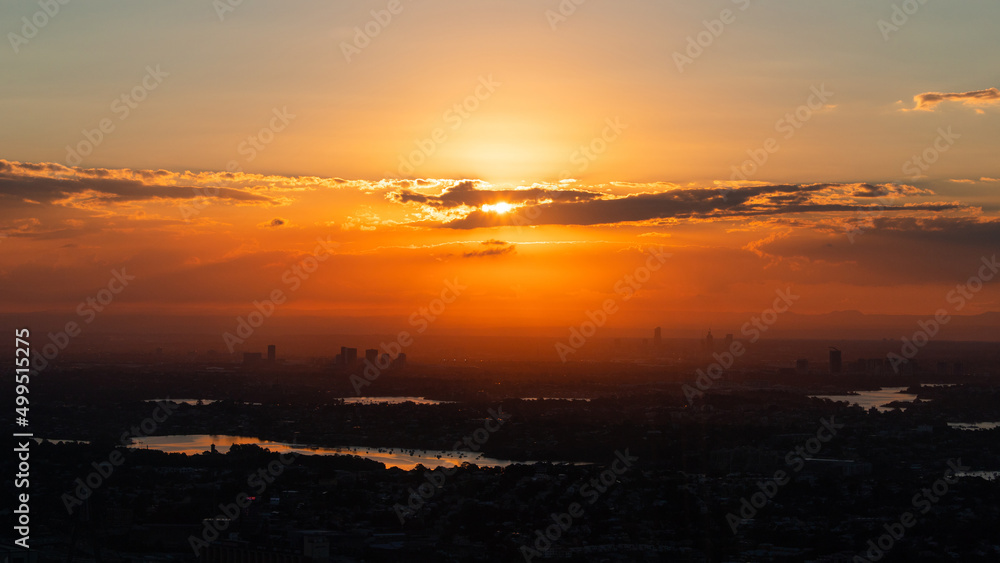 Rhodes and Parramatta skyline under the sunset light.