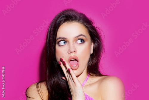 Shocked face of surprised young woman. Funny female shocked face expression. Portrait of excited woman spreading hands. Expressing surprise open mouth.