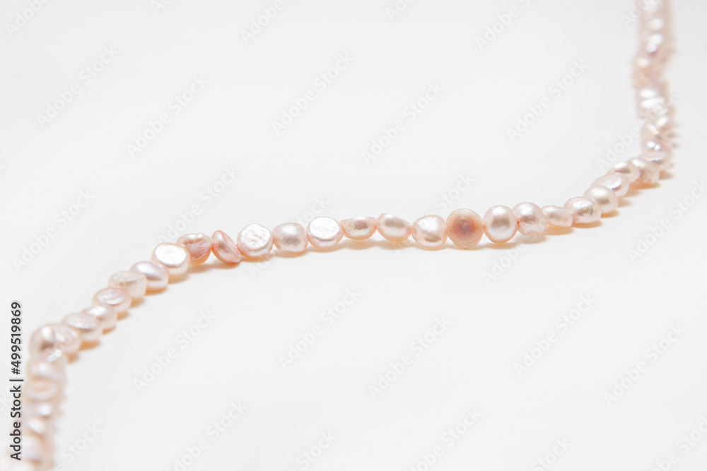 Pearl beads on a white background Pearl beads on a white background