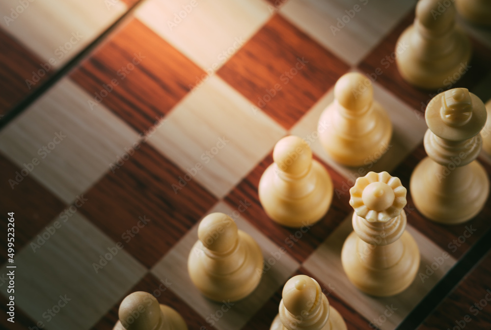 row of chess pieces on the chess board view from the top with vintage color tone row of chess pieces on the chess board view from the top with vintage color tone