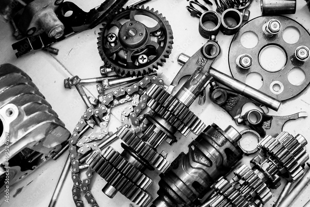 Parts of a motorcycle engine removed for maintenance. engine maintenance concept