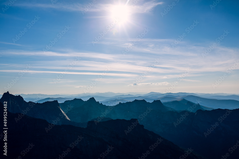 Gradient light against the background of rocks and mountains and blue sky in sunny weather