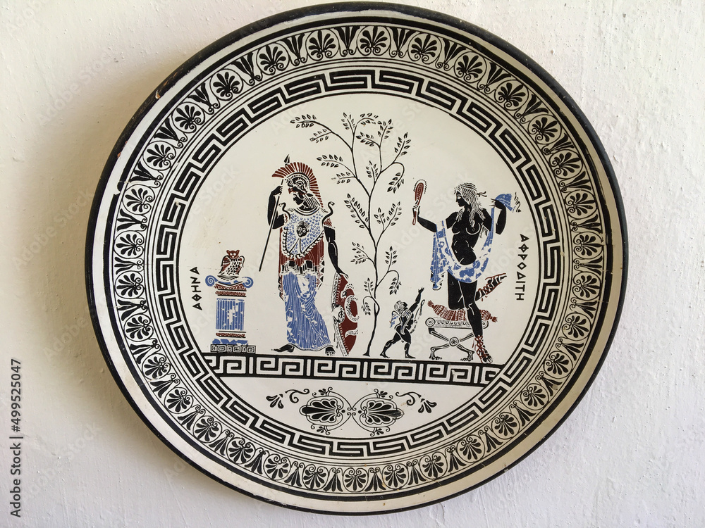 Rhodes, Greece - July 23, 2018: Plate with the image of the goddesses of Greek mythology Athena and Aphrodite. Close-up