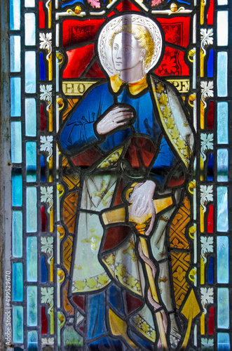 Historic stained glass window of Hope holding an anchor