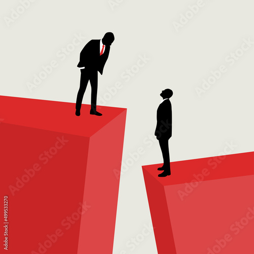 successful businessman looks at the man from above. Social inequality concept.