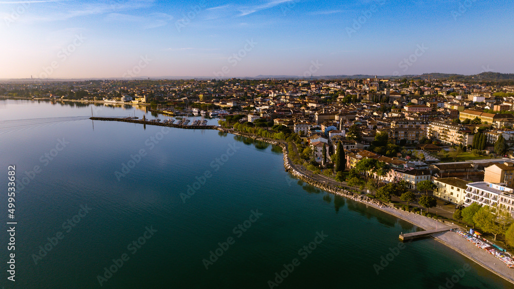 Fototapeta premium Aerial view of a lake town on a beautiful quiet morning 