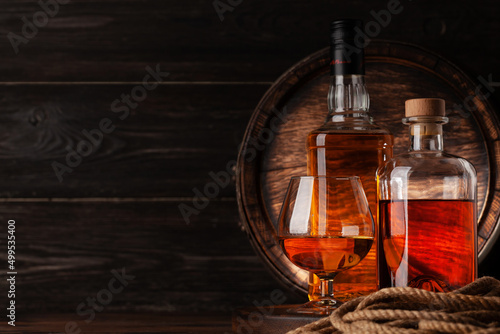Glass and bottles with cognac