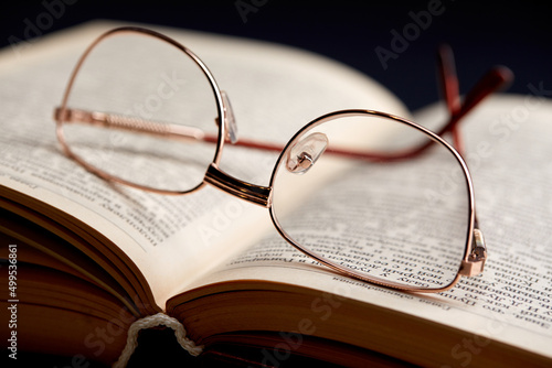 glasses on the book pages