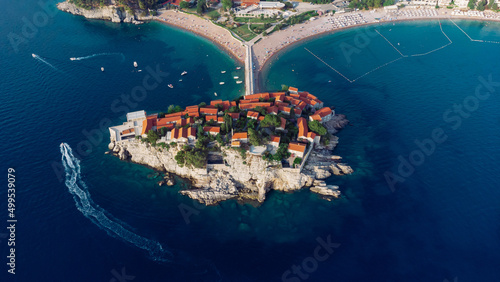 View from flying drone. Panoramic view of Sveti Stefan island in a beautiful summer day, Montenegro.Top View. Beautiful destinations.