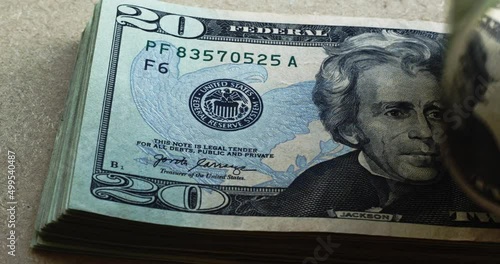 Andrew Jackson in 20 dollar bills USDs flipping into frame  4k photo