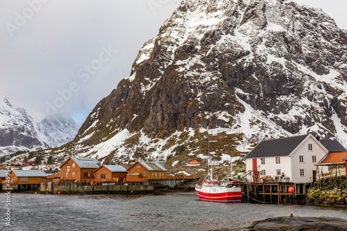 Moskenes Norway 02-28-2022. Fishing boats and  fisherman's house  called Rorbu at Moskenes in Lofotens islands. Norway. photo