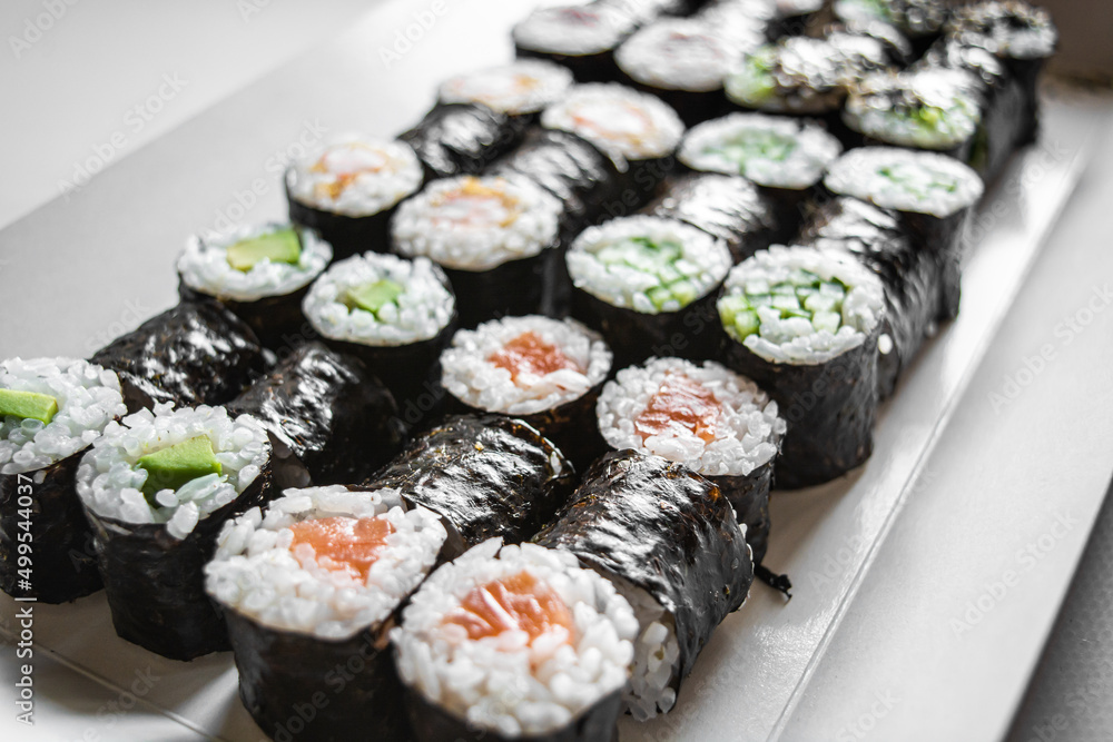 Sushi and rolls. Delicious set of fast food delivery on a white background Sushi and rolls. Delicious set of fast food delivery on a white background