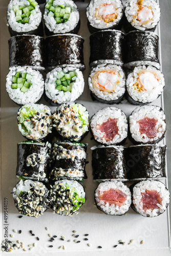 Set of sushi and maki roll on dark background .Top view