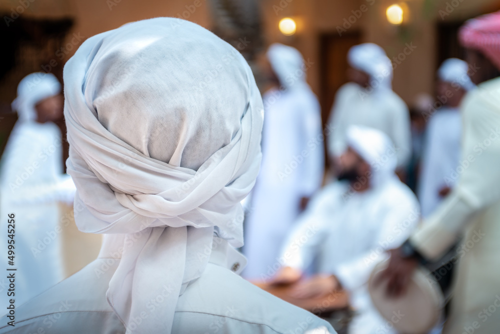 Emarati locals ( GCC - Gulf ) celebrating in their traditional way and dancing their traditional emirati yola dance Emarati locals ( GCC - Gulf ) celebrating in their traditional way and dancing their traditional emirati yola dance