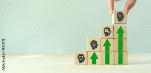 New skill, tech and digital skill concept for technology evolution. Soft, thinking, management, digital skill. Holding wooden cubes with digital icon. New skill, reskilling, upskilling training. photo