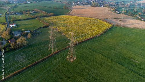 An aerial view of electricity pylons in rural Suffolk, UK