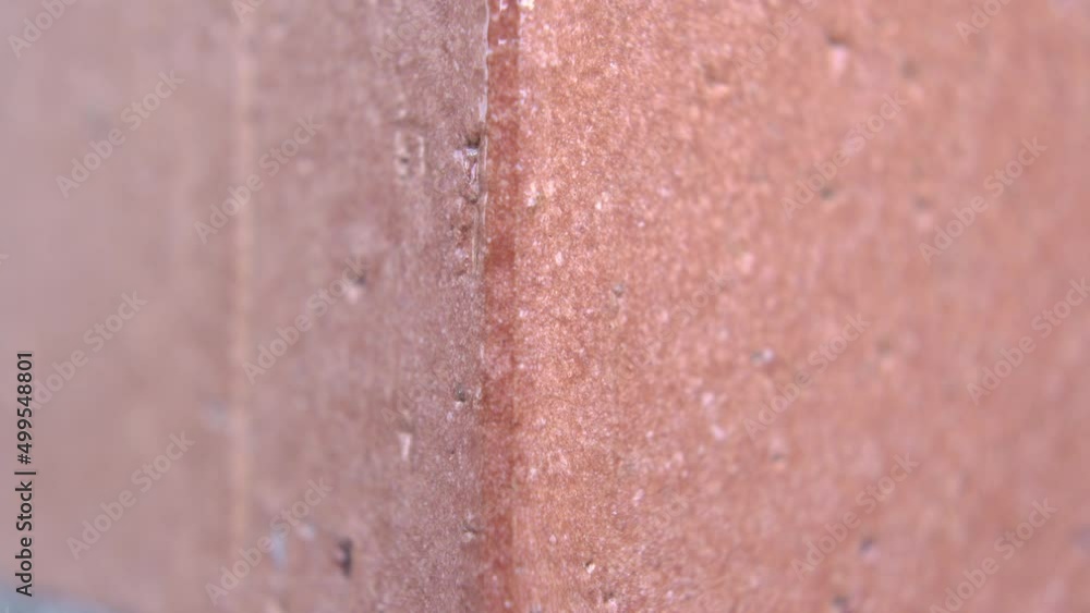 Corner of red brick wall. Building edge close-up. Macro. Dolly shot Corner of red brick wall. Building edge close-up. Macro. Dolly shot