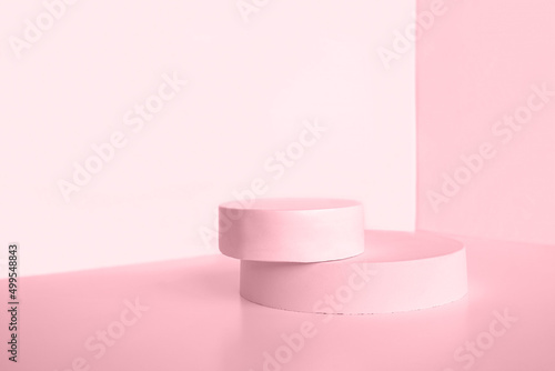 Podium for cosmetic product presentation. Abstract minimal geometrical form. Cylinder stone sphere two forms, shadow. Scene to show products. Showcase, display. Trendy sunlight. Front view. 3D