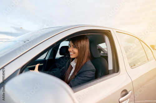 Beautiful young happy smiling woman driving her new car. © verona_studio