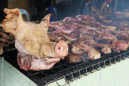 Sinalau Bakas translate to smoked wild boar, and the dish is simple as it sounds – slabs of marinated wild boar meat smoked on an open BBQ pit photo