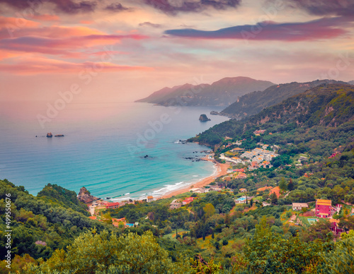 Aerial summer view of Pelekas beach. Exciting morning seascape of Ionian Sea. Stunning landscape of Corfu island, Kontogialos health resort, Greece, Europe. Vacation concept background..