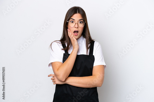 Restaurant Brazilian waiter woman isolated on white background surprised and shocked while looking right