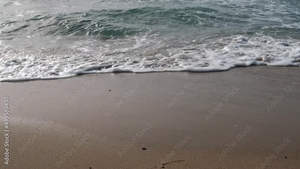 sea waves foam on beach sand sea waves foam on beach sand