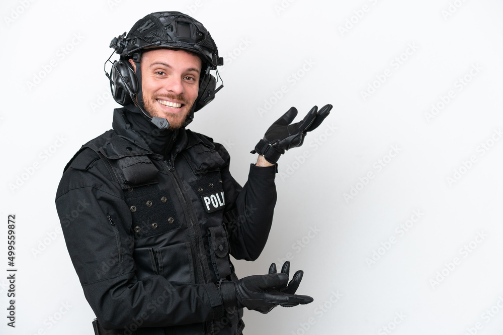 Brazilian soldier man isolated on white background extending hands to the side for inviting to come Brazilian soldier man isolated on white background extending hands to the side for inviting to come