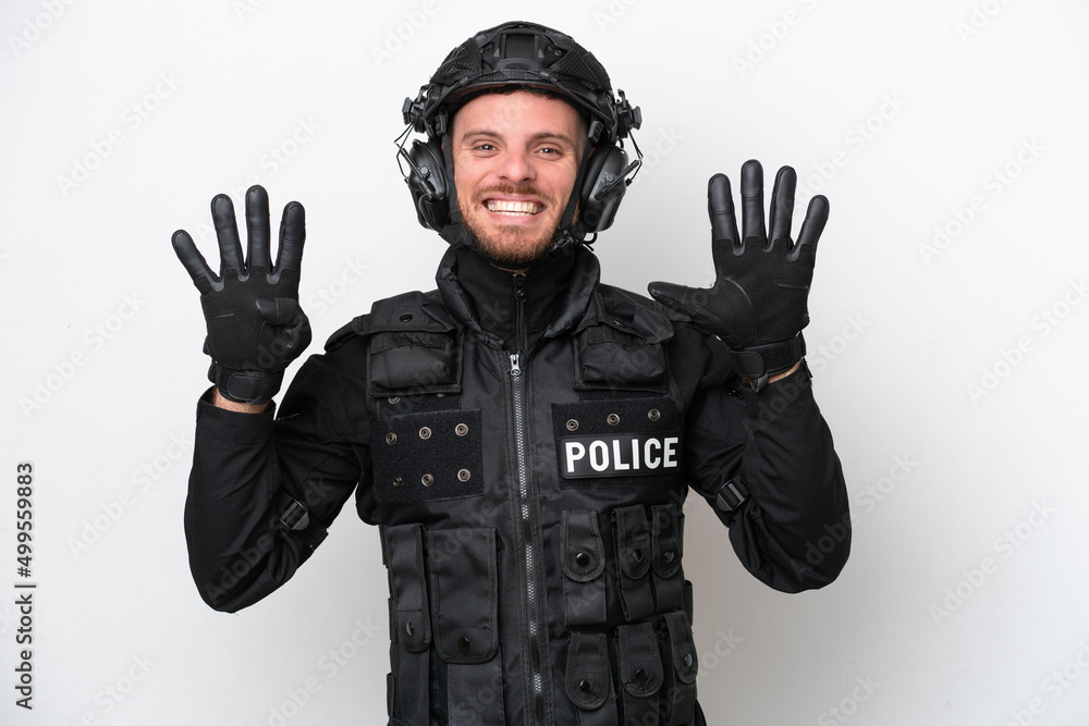 Brazilian soldier man isolated on white background counting nine with fingers Brazilian soldier man isolated on white background counting nine with fingers