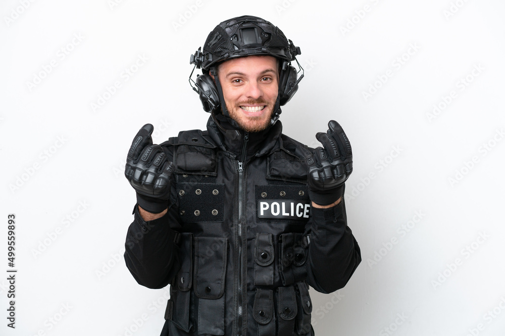 Brazilian soldier man isolated on white background making money gesture Brazilian soldier man isolated on white background making money gesture