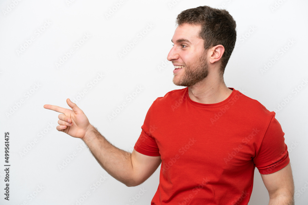 Young caucasian man isolated on white background pointing finger to the side and presenting a product Young caucasian man isolated on white background pointing finger to the side and presenting a product