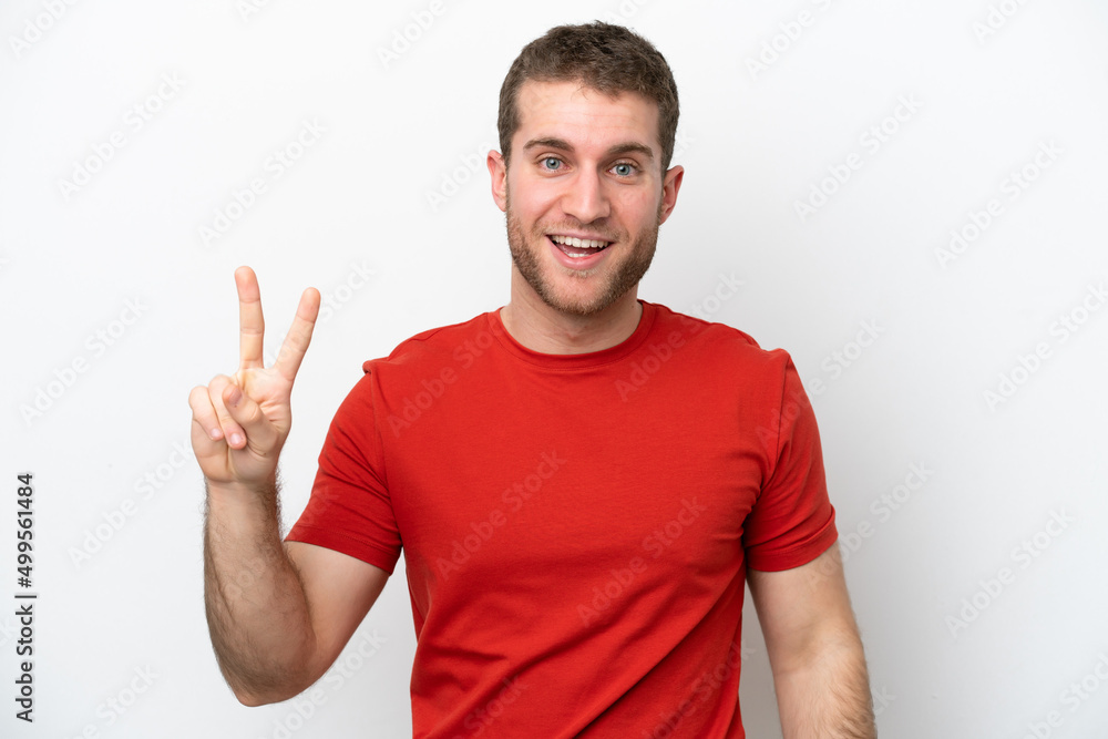 Young caucasian man isolated on white background smiling and showing victory sign Young caucasian man isolated on white background smiling and showing victory sign