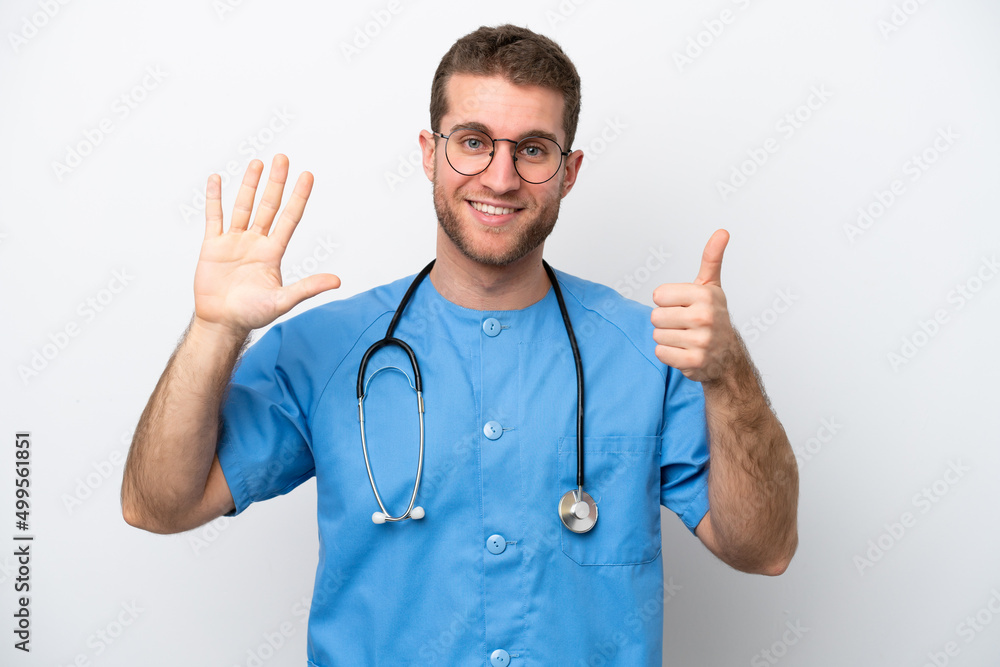 Young surgeon doctor caucasian man isolated on white background counting six with fingers Young surgeon doctor caucasian man isolated on white background counting six with fingers