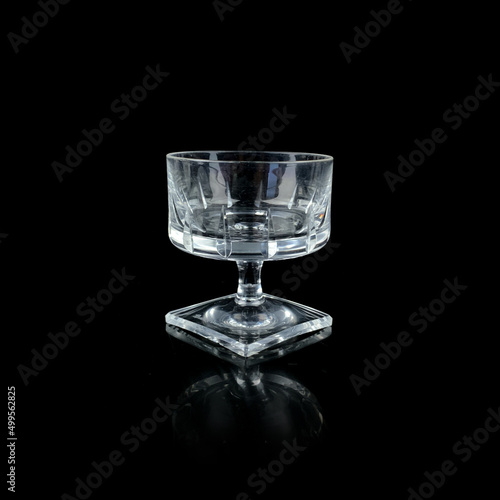 crystal antique wine glass. vintage glass goblet for alcoholic beverages on a black isolated background