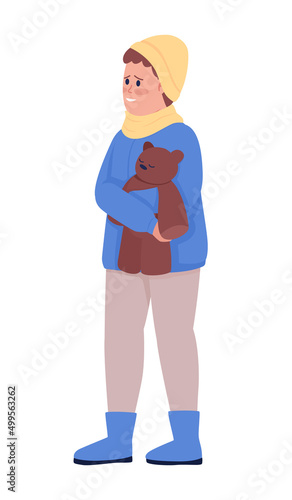 Little boy with plush bear smiling with gratitude semi flat color vector character. Standing figure. Full body person on white. Simple cartoon style illustration for web graphic design and animation