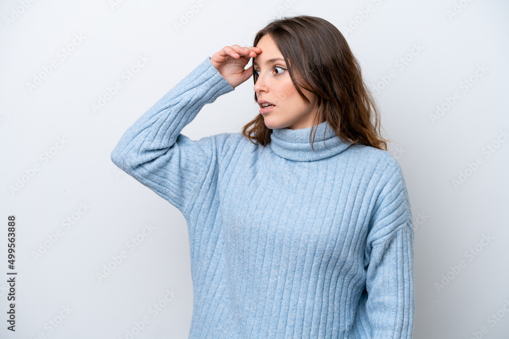 Young caucasian woman isolated on white background with surprise expression while looking side Young caucasian woman isolated on white background with surprise expression while looking side