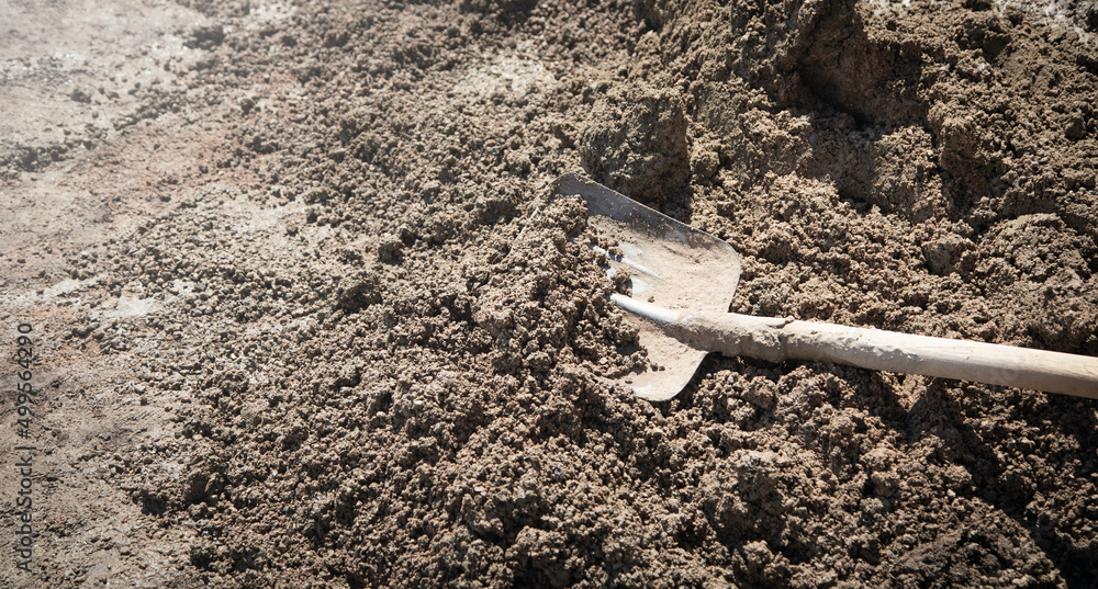 Shovel with a cement. Construction site Shovel with a cement. Construction site