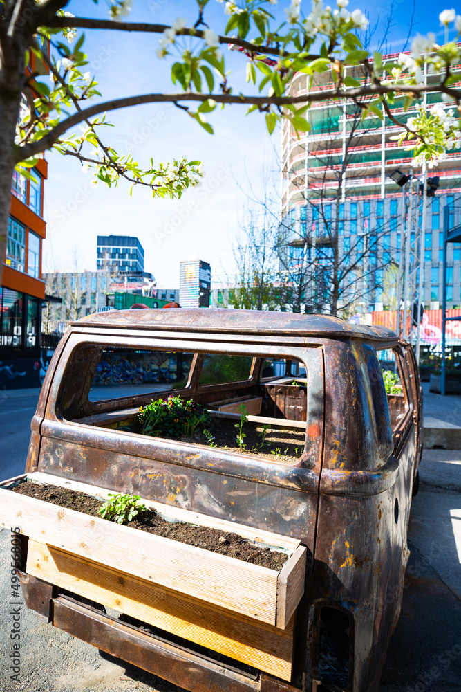 Obraz premium VW bus planted with flowers, old VW bus with flowers