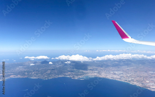 Aerial view from a plane above the Mediterranean Sea to Palma de Mallorca in summer