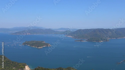 宮島の弥山頂上から見える瀬戸内海に浮かぶ島々と広島市と廿日市市の風景  パンショット  4K  2022年4月17日 photo