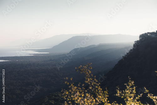 Scenir view of Manyara lake at sunset, touristic sight in tanzania, with cliffs and the national park on the foreground photo