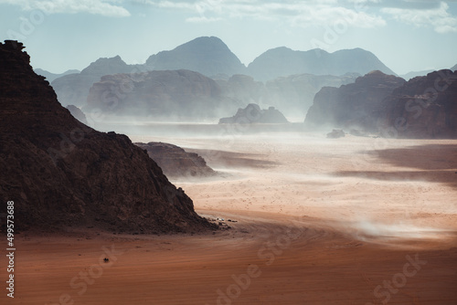 Panorama of Wadi Rum desert in Jordan, natural landscape surrounded by dry and rocky mountains, beautiful attraction in the middle east for adventure tourism