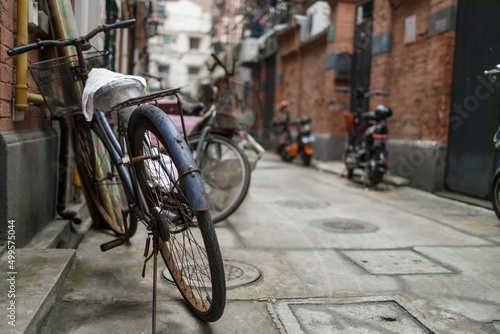 Bicycles and scooters in typical Shanghai residential area.