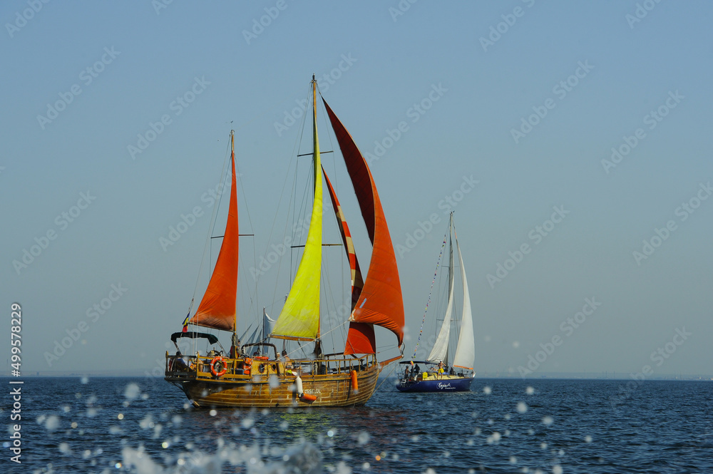 Seascape with sailboat the background of the blue sky.Beautiful sailboat sailing sail blue Mediterranean sea ocean horizon. Seascape with sailboat the background of the blue sky.Beautiful sailboat sailing sail blue Mediterranean sea ocean horizon.