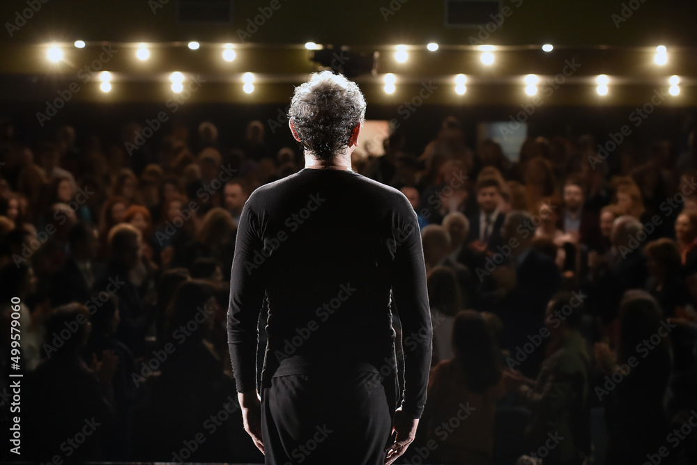 © samy - actor on stage receiving applause from the audience. photo inside. © samy - actor on stage receiving applause from the audience. photo inside.