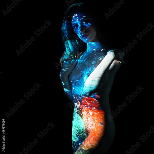 Projection from beamer or projector on woman looks like body painting photo